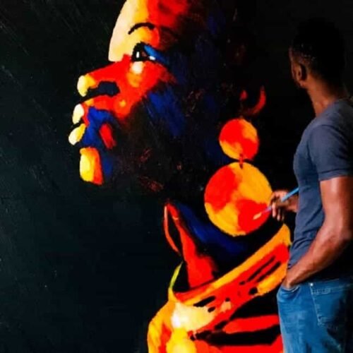 Fobally in-house artist painting at our African Contemporary Art Gallery Studio